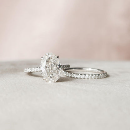 2 CT Oval Cut Lab Grown Diamond Engagement Ring Bridal Set with a dazzling pave setting. The perfect Anniversary Day gift set for her.