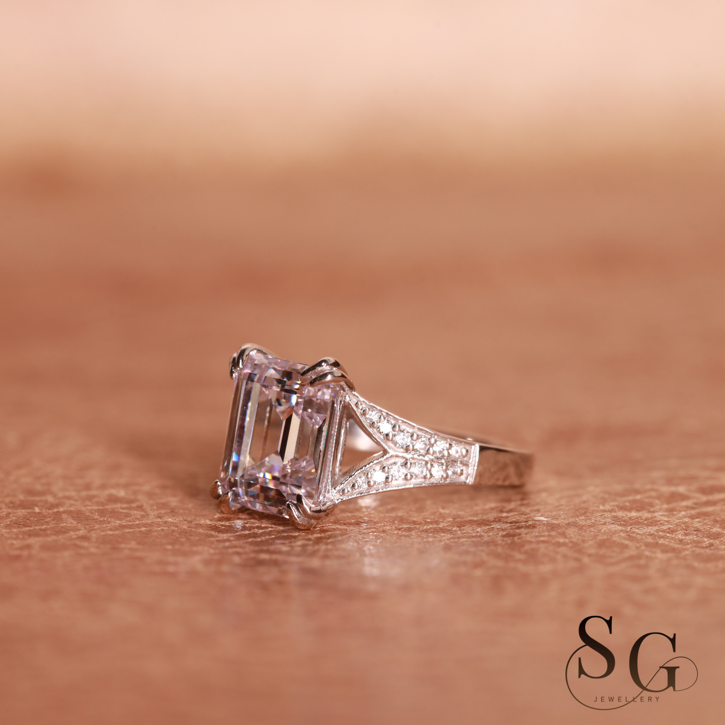 Emerald cut lab grown diamond on 18k white gold band