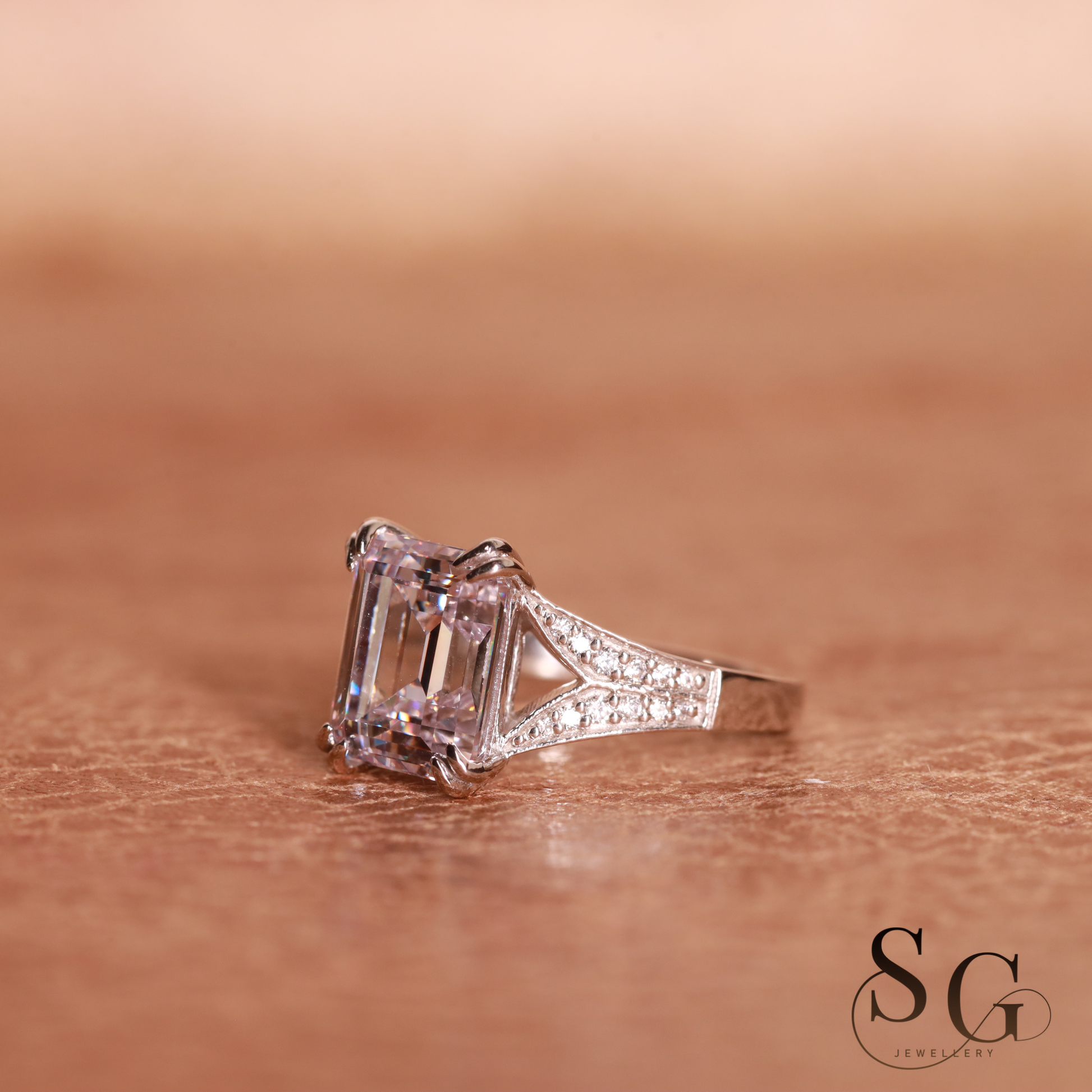 Emerald cut lab grown diamond on 18k white gold band