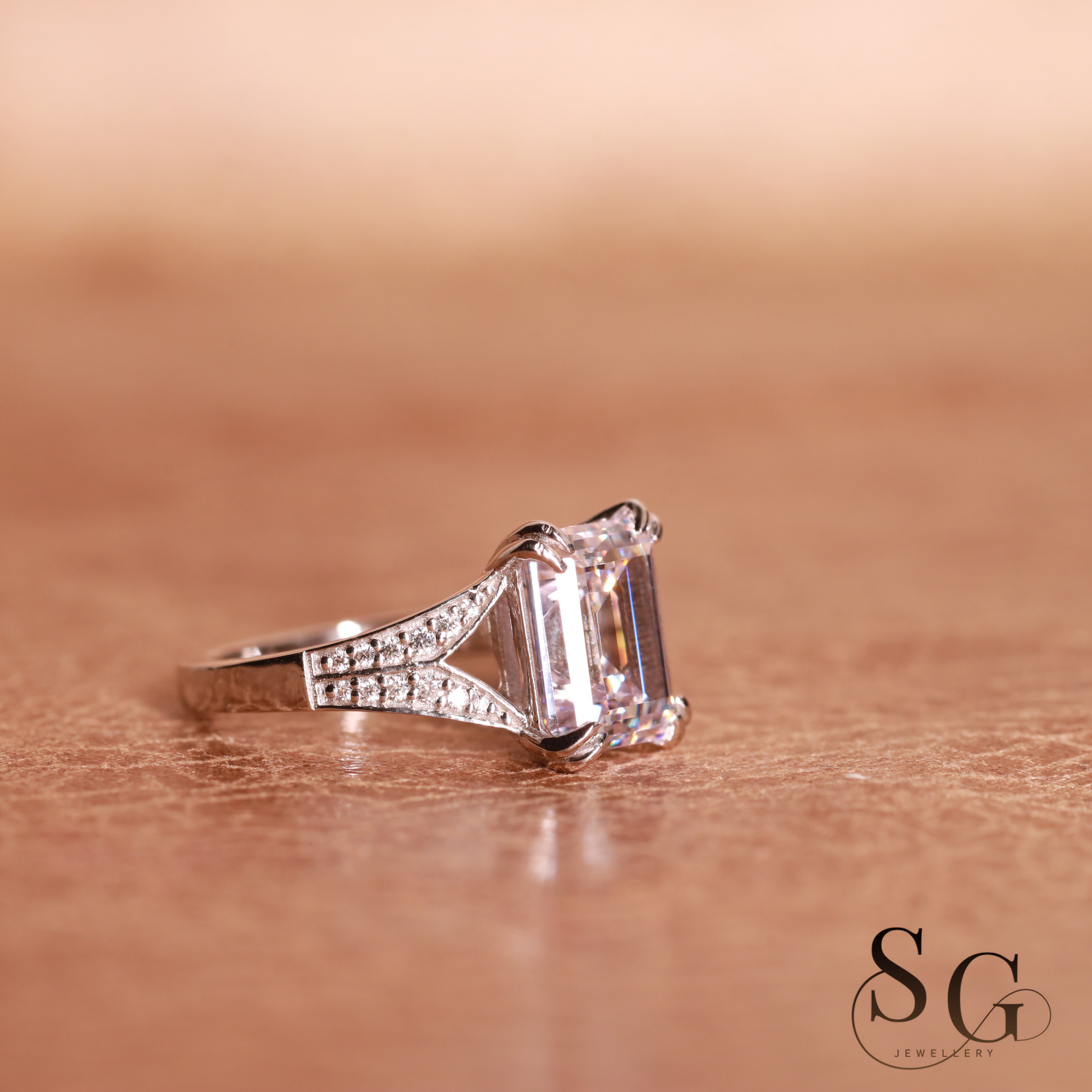 Emerald cut lab grown diamond on 18k white gold band