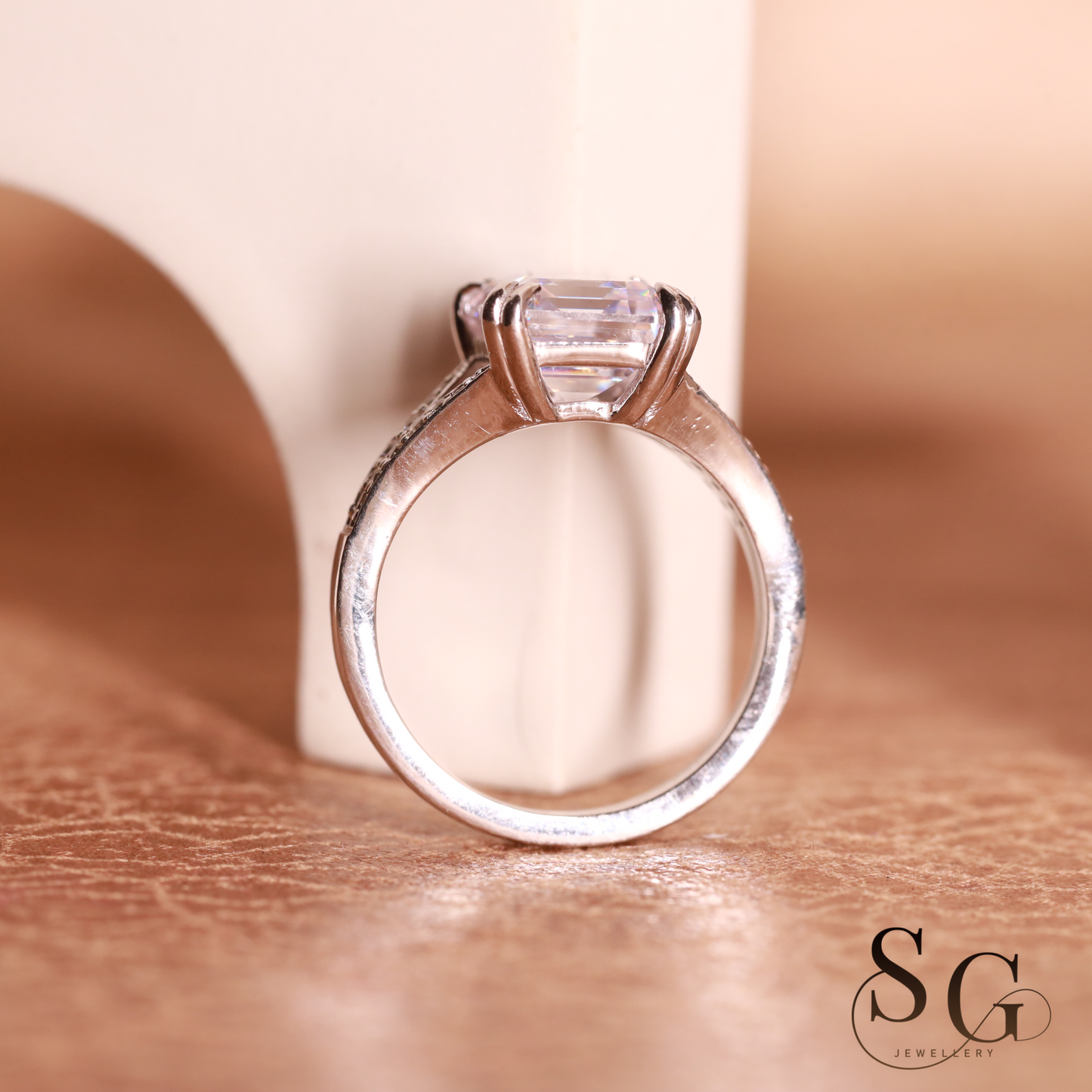 Emerald cut lab grown diamond on 18k white gold band