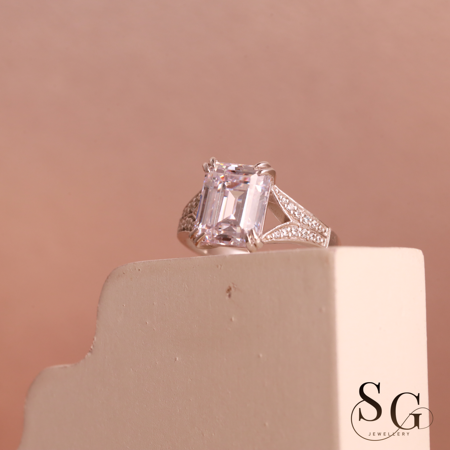 Emerald cut lab grown diamond on 18k white gold band