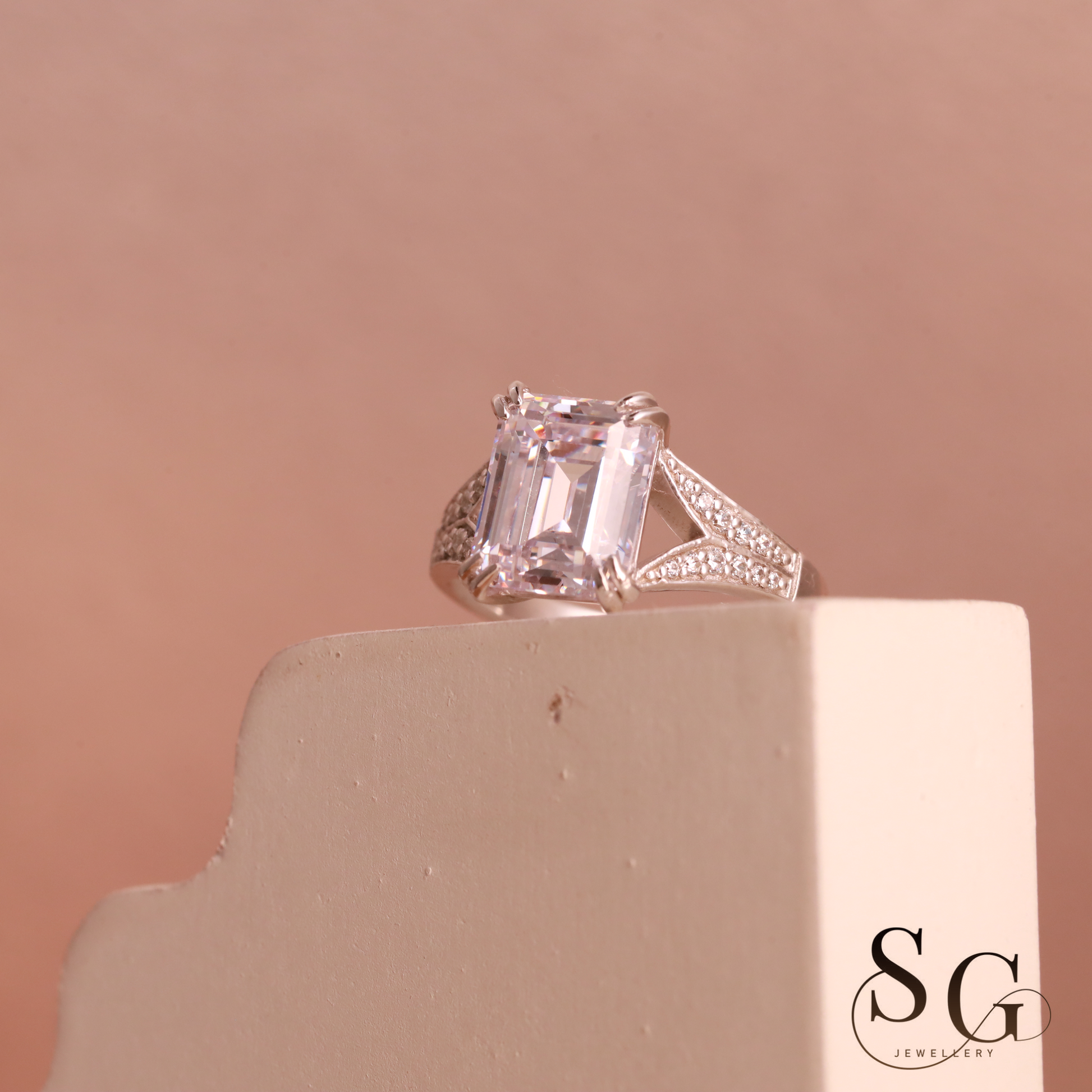 Emerald cut lab grown diamond on 18k white gold band