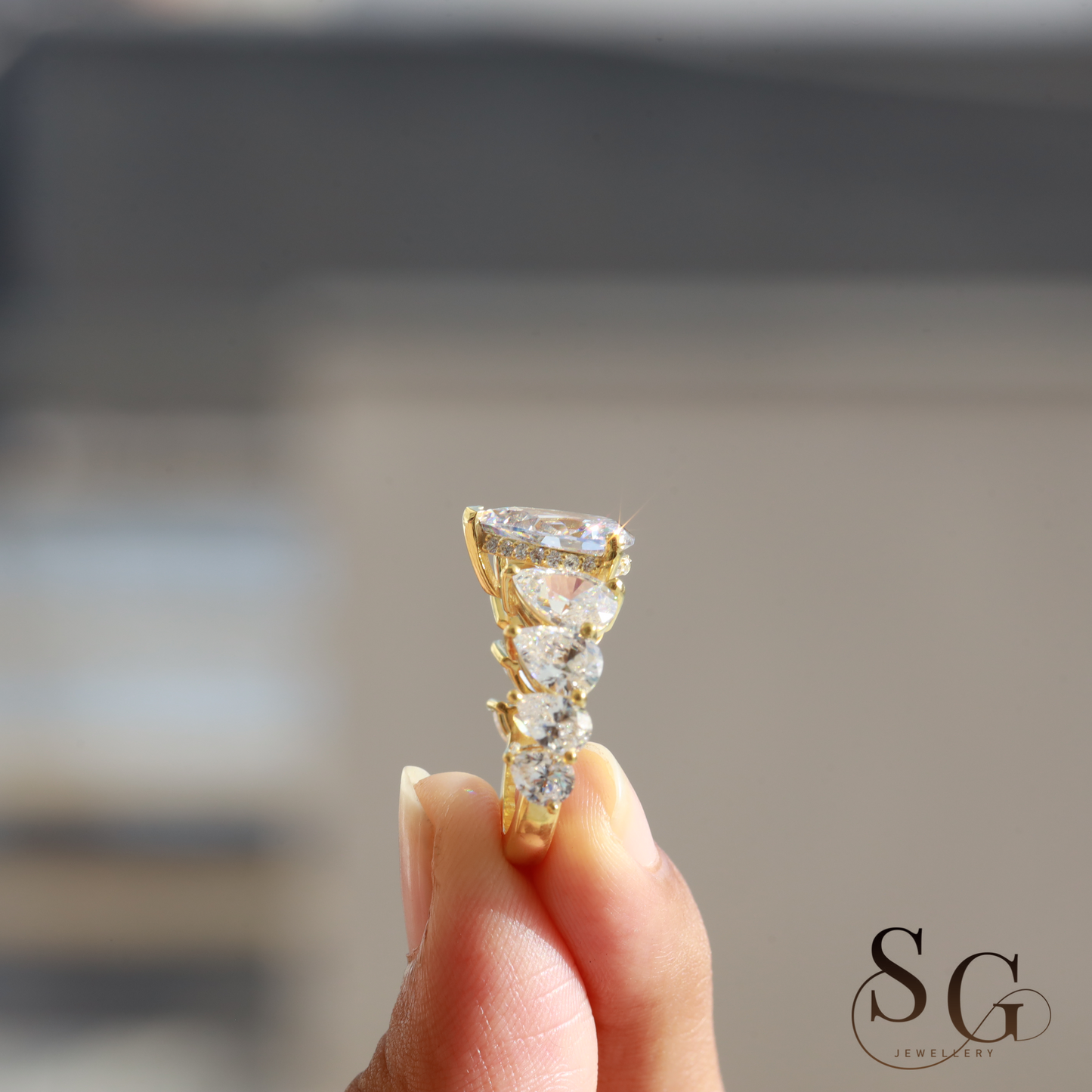 Pear Lab Diamond Hidden Halo Engagement Ring for Anniversary Celebrations.