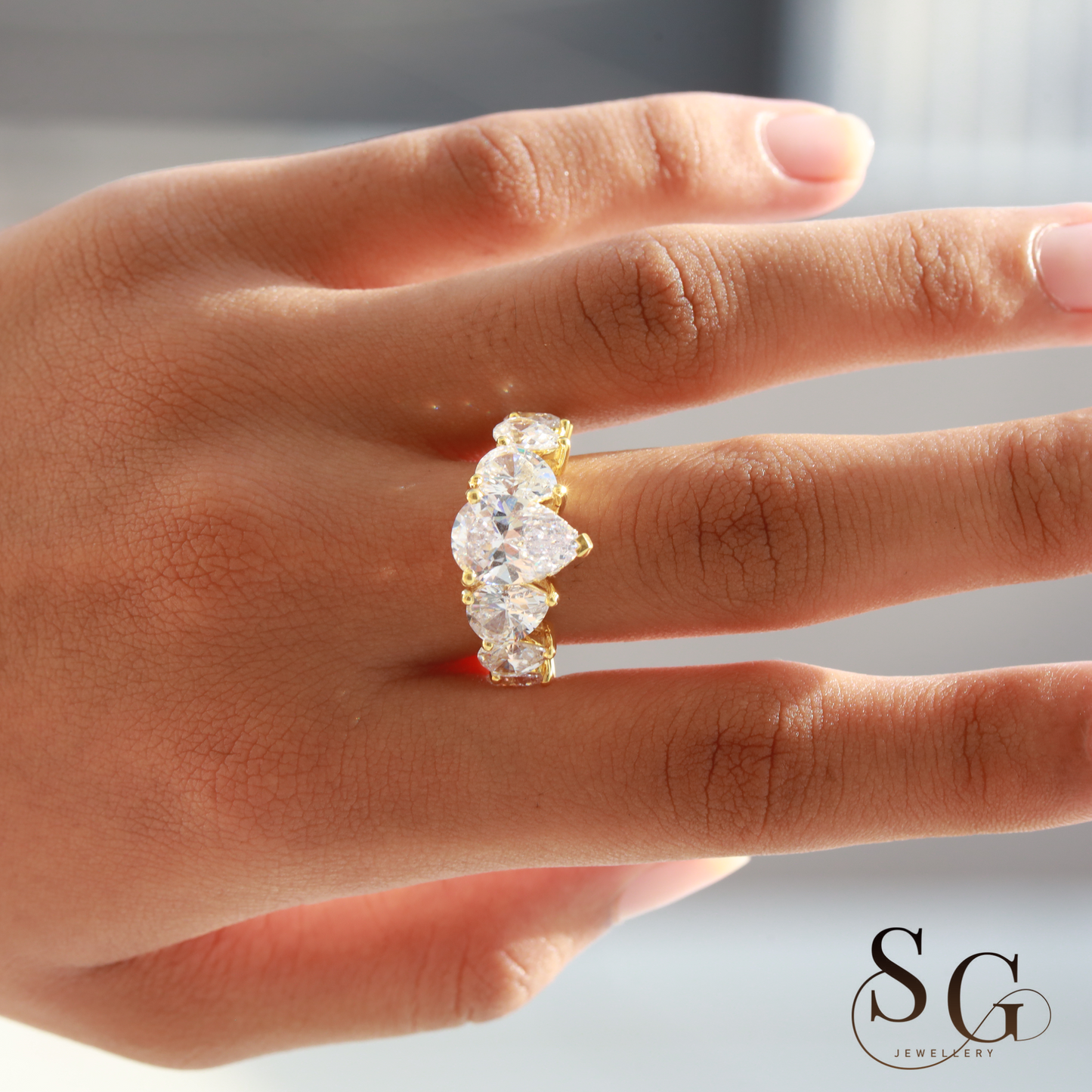 Pear Lab Diamond Hidden Halo Engagement Ring for Anniversary Celebrations.
