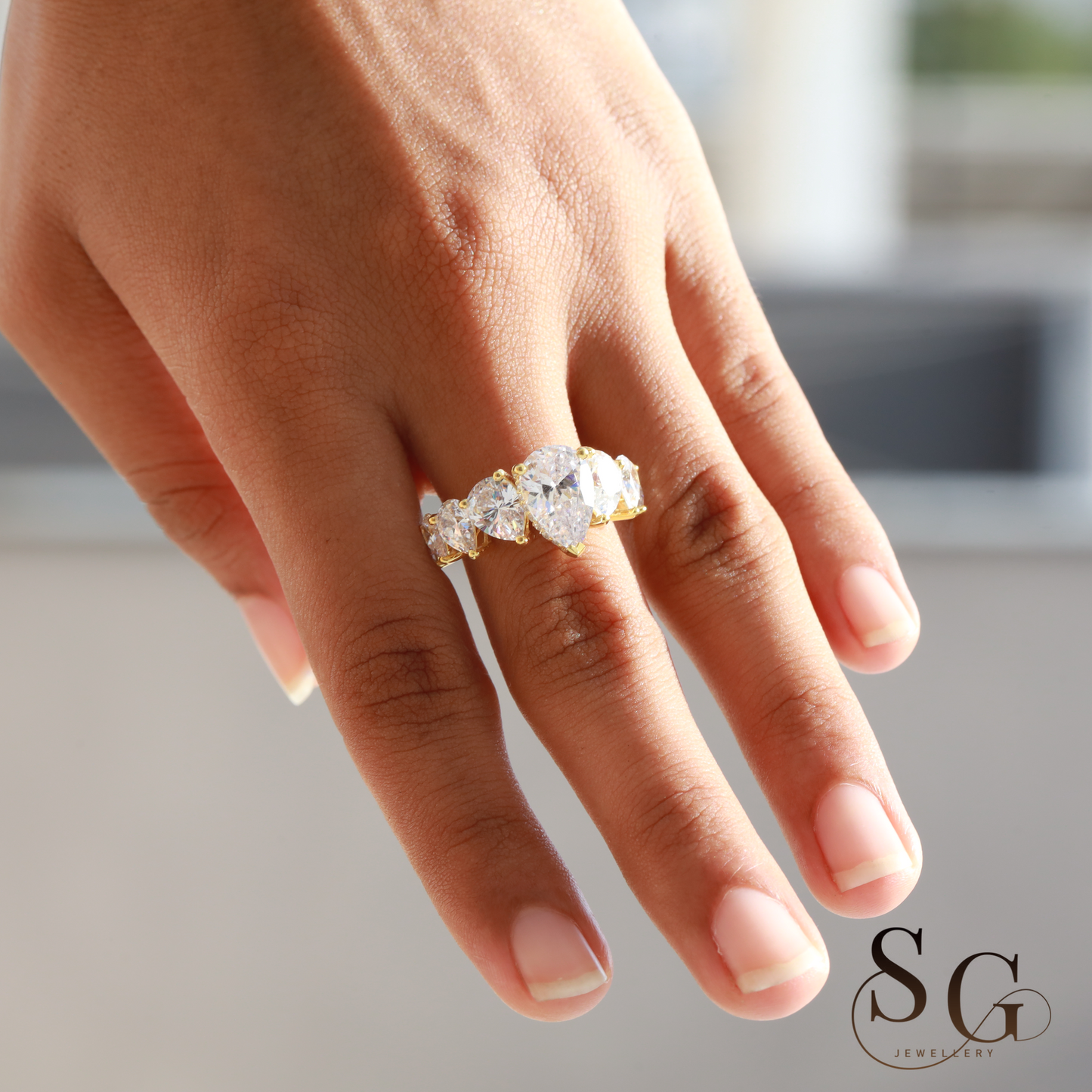 Pear Lab Diamond Hidden Halo Engagement Ring for Anniversary Celebrations.