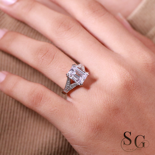 Emerald cut lab grown diamond on 18k white gold band